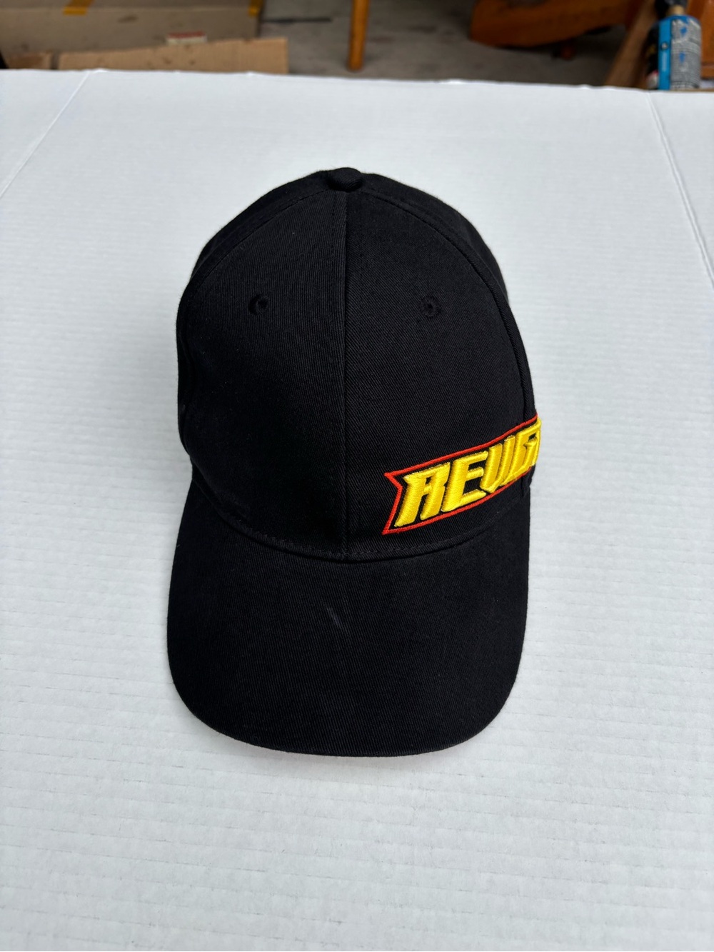Black Baseball Cap with Yellow & Red Embroidered Patch